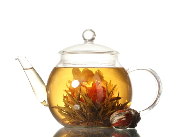 Exotic green tea with flowers in glass teapot isolated on white — Stock Photo, Image