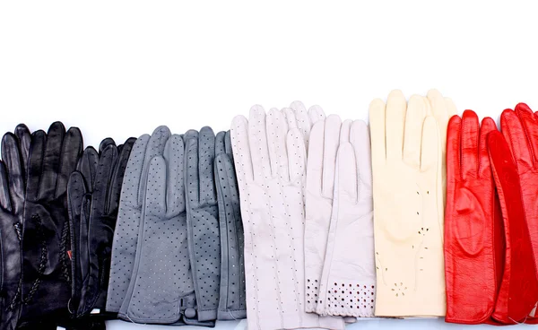 O mulțime de femei frumoase mănuși din piele izolate pe alb — Fotografie, imagine de stoc