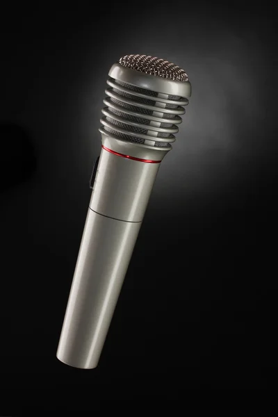 Shiny grey iron microphone on black background — Stock Photo, Image