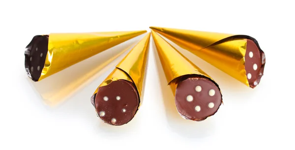 Сhocolate candy in the shape of a horn in the gold package isolated on whit — Stock Photo, Image