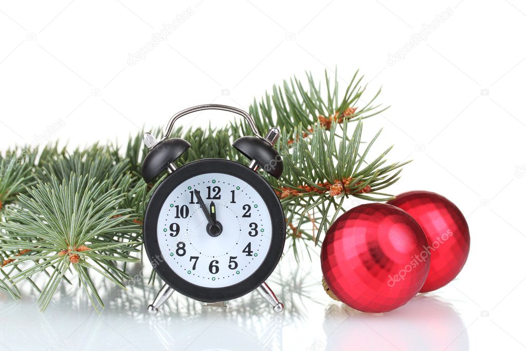 Green Christmas tree with toy and clock isolated on white