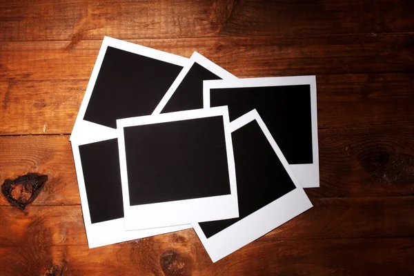 Carta fotografica su sfondo di legno — Foto Stock