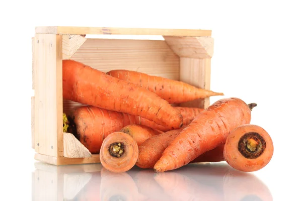 stock image Raw carrots in wooden box isolated on white