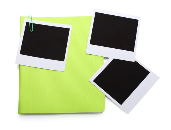 Papeles fotográficos y cuaderno verde aislados en blanco —  Fotos de Stock
