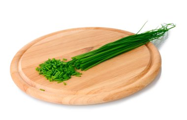 Beautiful green onion chives on wooden board isolated on white clipart