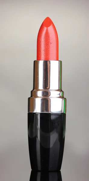 Beautiful lipstick on gray background — Stock Photo, Image