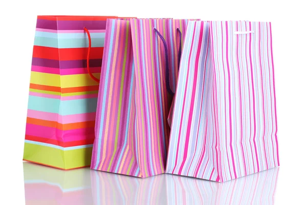 Bolsas de regalo brillantes aisladas en blanco —  Fotos de Stock