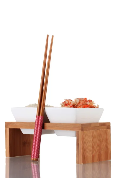 stock image Rice and shrimp in bowls on wooden stand isolated on white