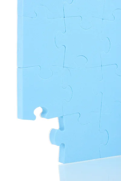 Puzzle bleu gros plan, isolé sur blanc — Photo
