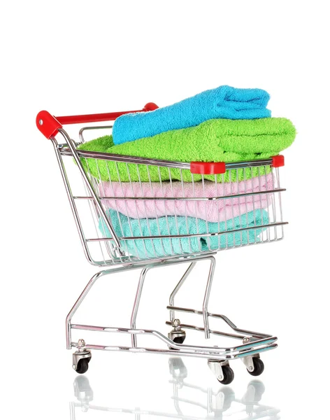 Shopping cart and towels isolated on white — Stock Photo, Image