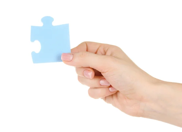 Puzzle azul con una mano aislada en blanco — Foto de Stock