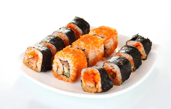 Utsökt sushi på plattan isolerad på vit — Stockfoto