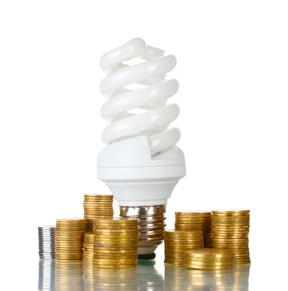 Energiatakarékos lámpa és a pénz elszigetelt fehér — Stock Fotó