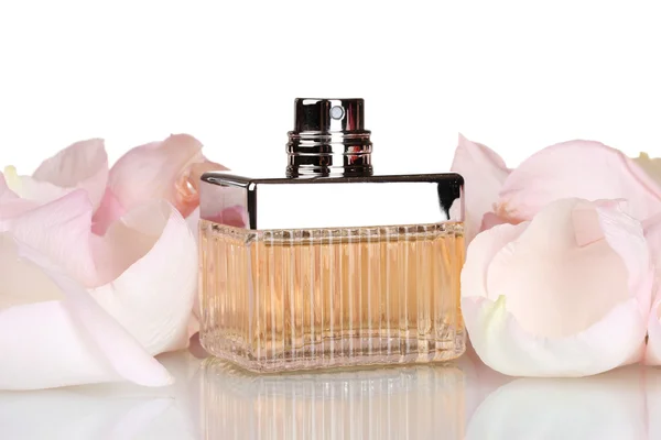 Perfume in a beautiful bottle and petals isolated on white — 스톡 사진