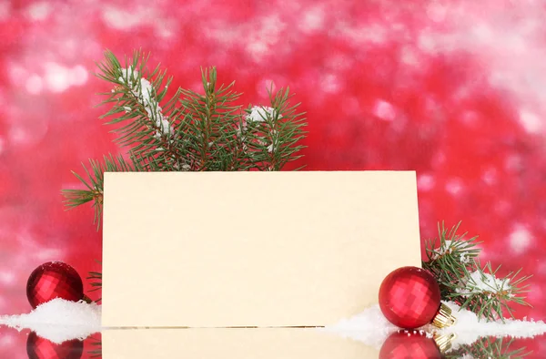 Blank postcard, Christmas balls and fir-tree on red background Stock Image