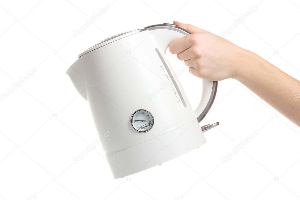 Womens hand and white electric kettle isolated on white