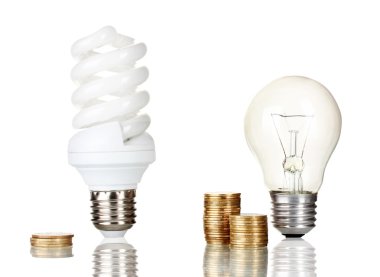 Comparison of ordinary light bulbs with energy saving lamp isolated on whit clipart