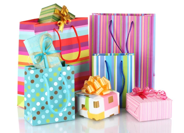 Bright gift bags and gifts isolated on white — Stock Photo, Image