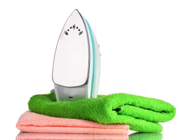 Two towels and iron isolated on white clipart