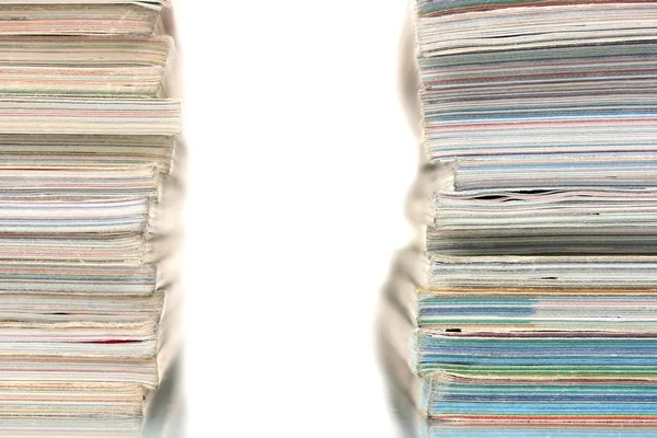 Two stacks of magazines isolated on white — Stock Photo, Image
