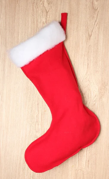 stock image Christmas sock on wooden background