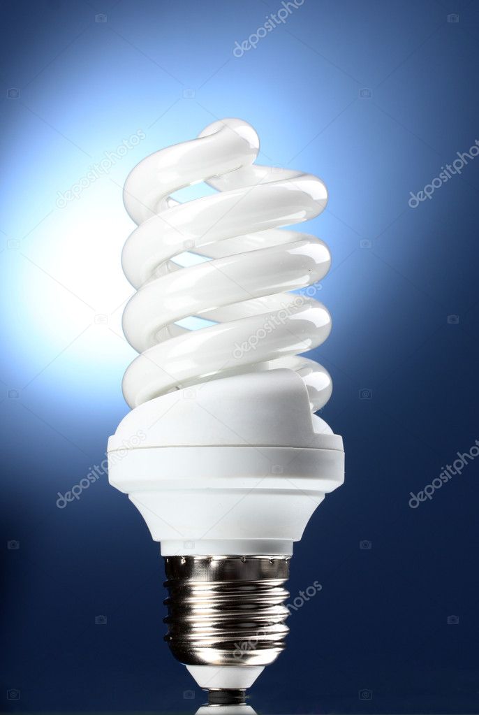 Energy saving lamp on blue background