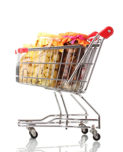 Delicious marinated mushrooms in the glass jars in shopping cart isolated o — Stock Photo, Image