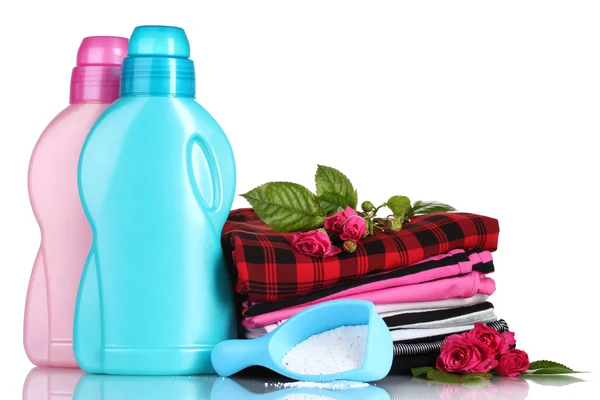 Detergent with washing powder and pile of colorful clothes isolated on whit — Stock Photo, Image