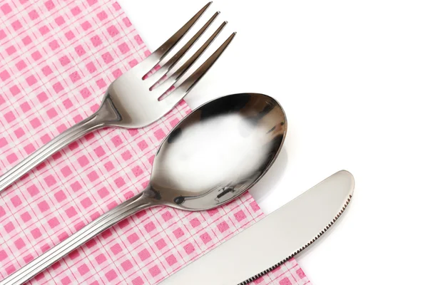 Lepel, vork en mes in een geruite doek met een boog geïsoleerd op wit — Stockfoto