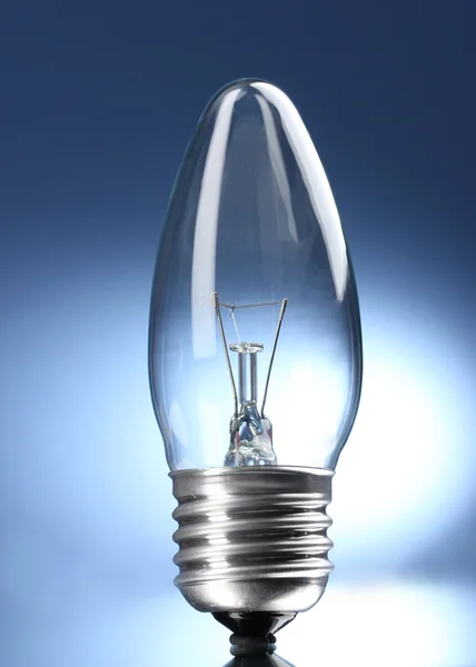 Light bulb on blue background Stock Picture