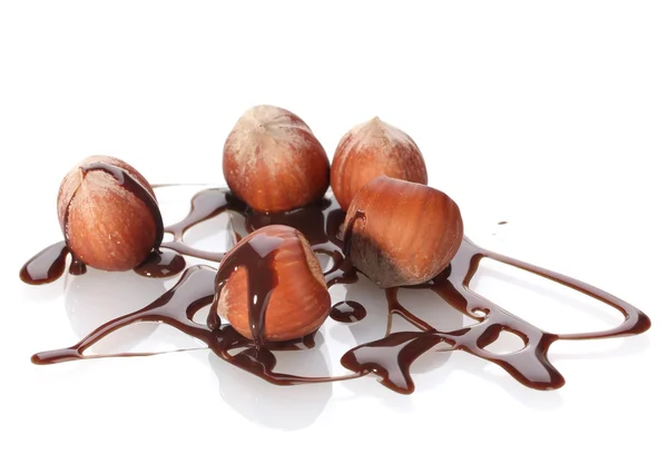 stock image Delicious hazelnut and chocolate syrup isolated on white