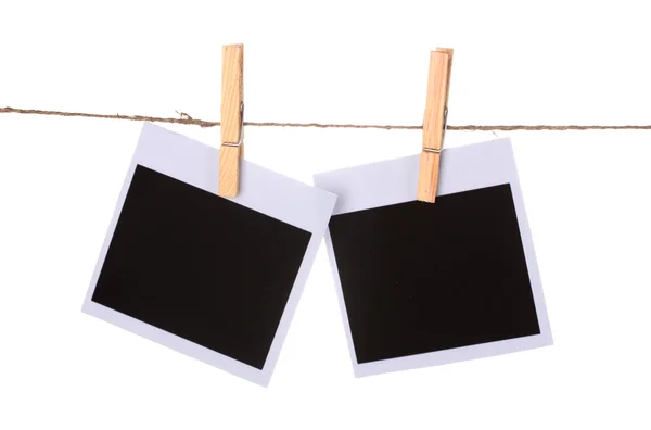 Photo paper hanging on the clothesline isolated on white — Stock Photo, Image