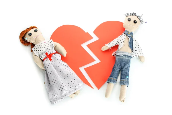 stock image Two voodoo dolls boy and girl on the broken heart isolated on white