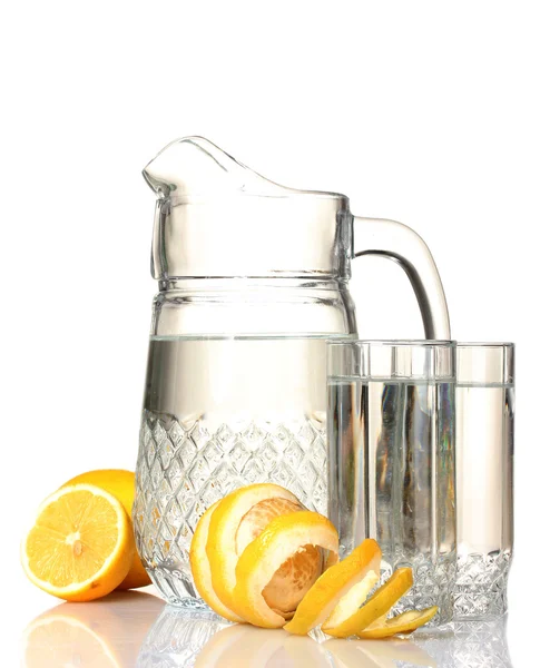 Pitcher and glasses of lemonade and lemon isolated on white — Stock Photo, Image