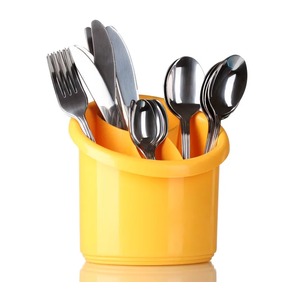 Kitchen cutlery, knives, forks and spoons in yellow stand isolated on white — Stock Photo, Image