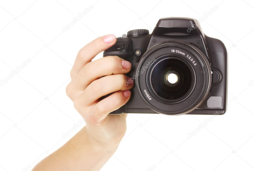 Digital photo camera in hand isolated on white