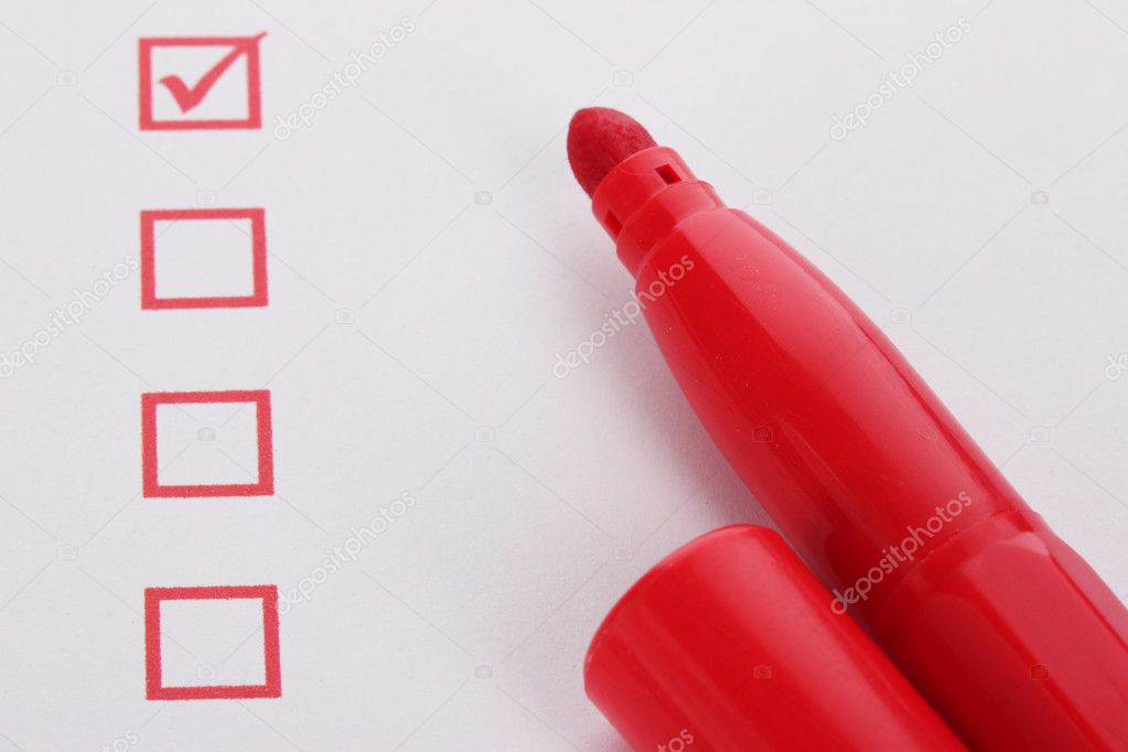 Checklist and red marker closeup