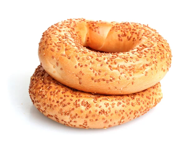 Delicious bagels with sesame seeds isolated on white — Stock Photo, Image