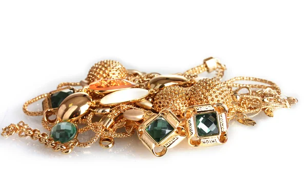 Verschillende gouden sieraden geïsoleerd op wit — Stockfoto
