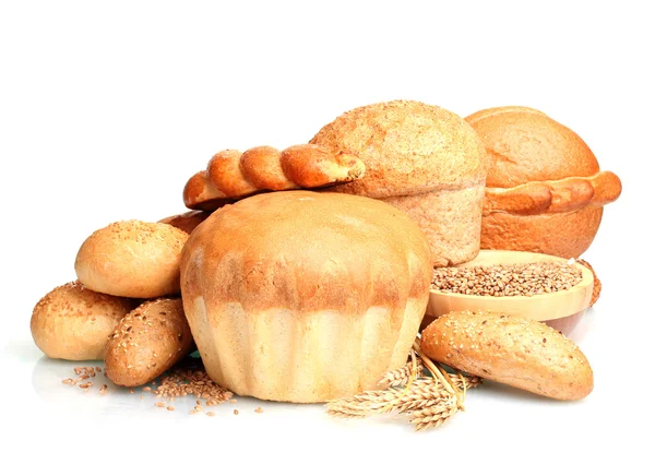 Delicious round bread, buns and wheat isolated on white — Stock Photo, Image