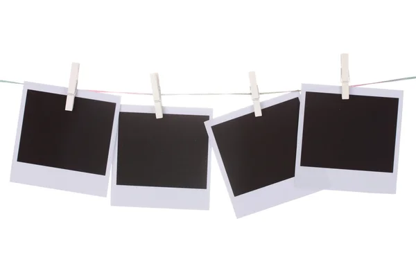 Photo paper hanging on the clothesline isolated on white — Stock Photo, Image
