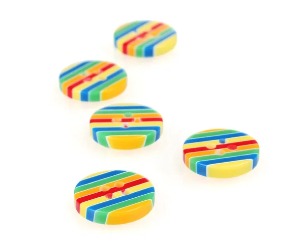 Bright striped sewing buttons isolated on white — Stock Photo, Image