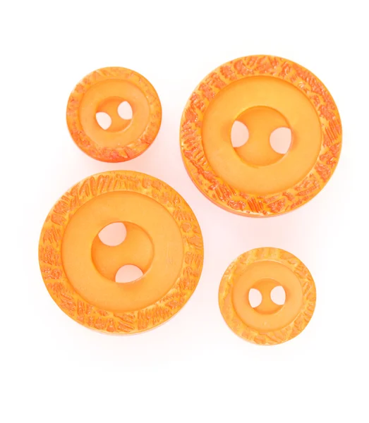 Bright orange sewing buttons isolated on white — Stock Photo, Image