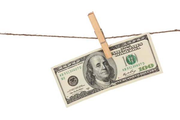 Stu dolarowe wisi na lina z isolat drewniane clothespin — Zdjęcie stockowe