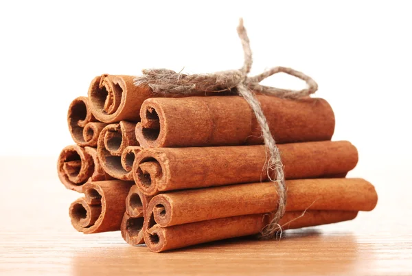 Cinnamon sticks on wooden table — Stock Photo, Image