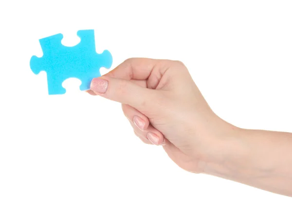 Blaues Puzzle mit einer Hand isoliert auf weißem Hintergrund — Stockfoto