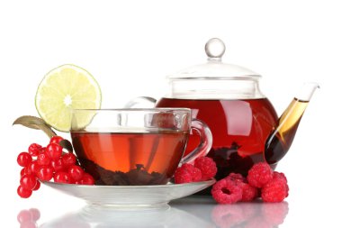 Black fruit tea in glass teapot and cup isolated on white clipart