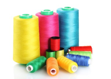 Many-coloured bobbins of thread isolated on white clipart