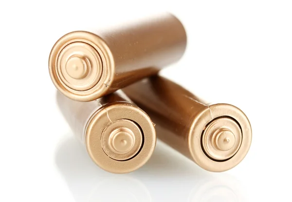 Três baterias douradas isoladas em branco — Fotografia de Stock
