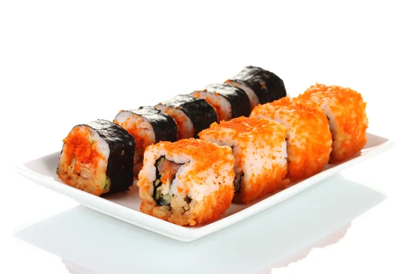 Delicioso sushi na placa isolado no branco — Fotografia de Stock